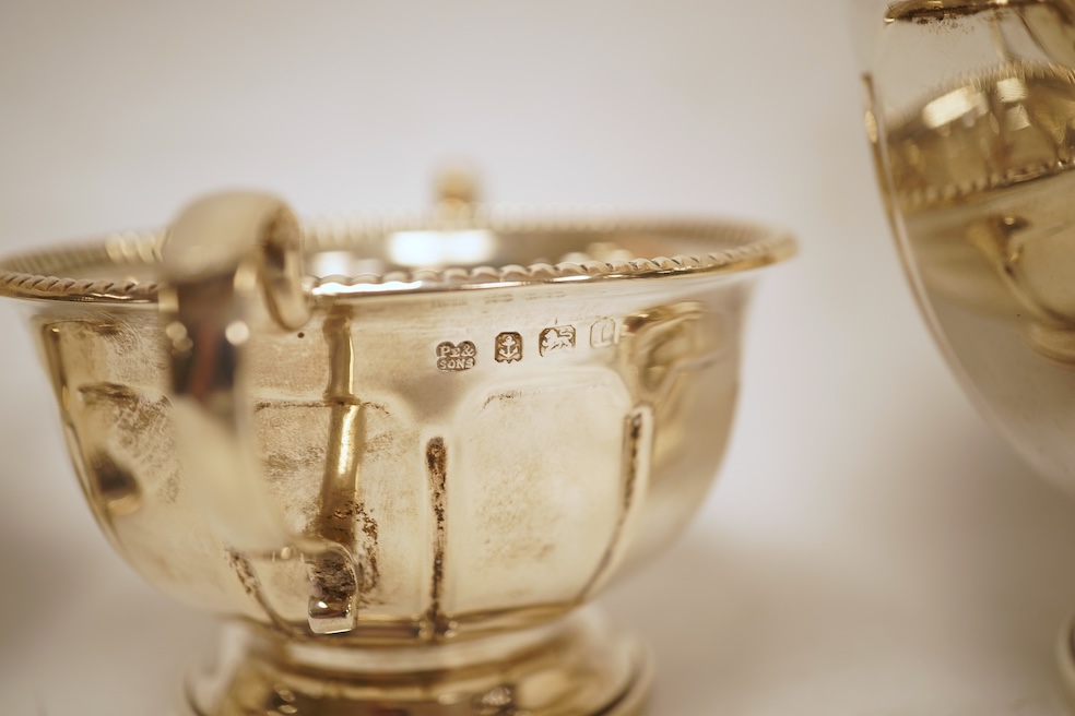 A George V three piece silver tea set by Pearce & Sons & Sons, Birmingham, 1935, gross weight 26.6oz.